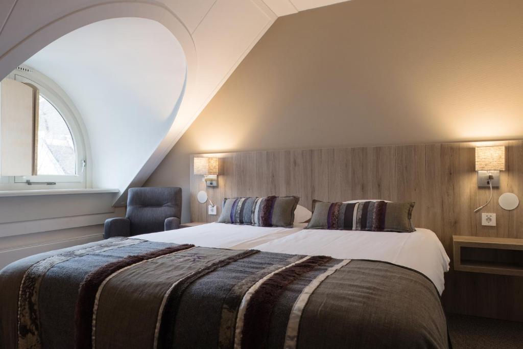 Postel nebo postele na pokoji v ubytování Landgoedhotel Woodbrooke Barchem