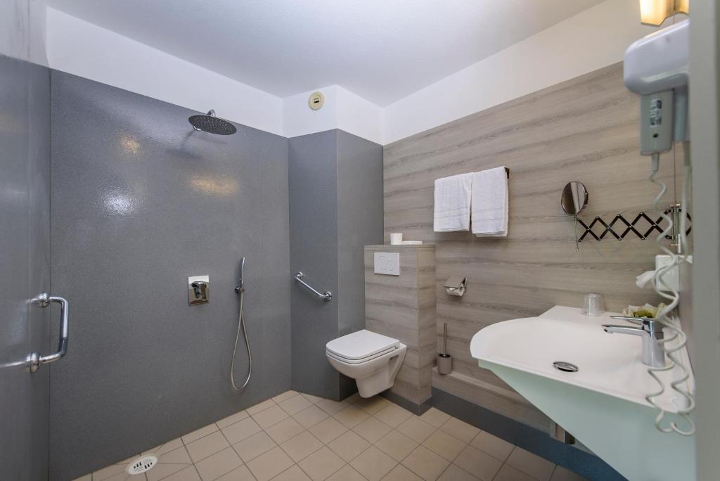 Koupelna v ubytování Hotel Le Chatard