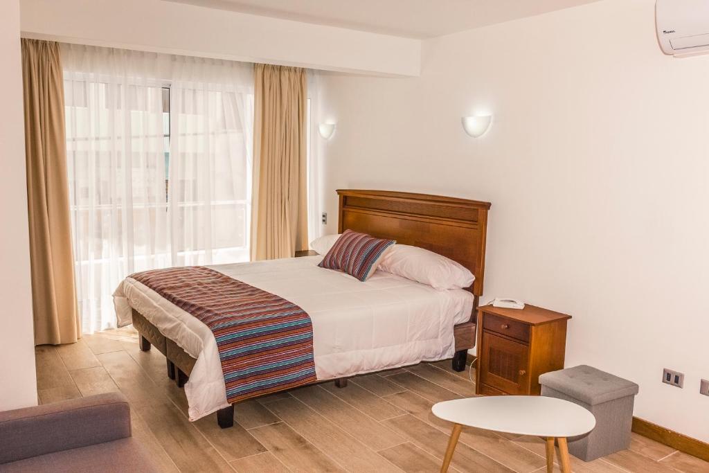 מיטה או מיטות בחדר ב-Apart Hotel Viscachani