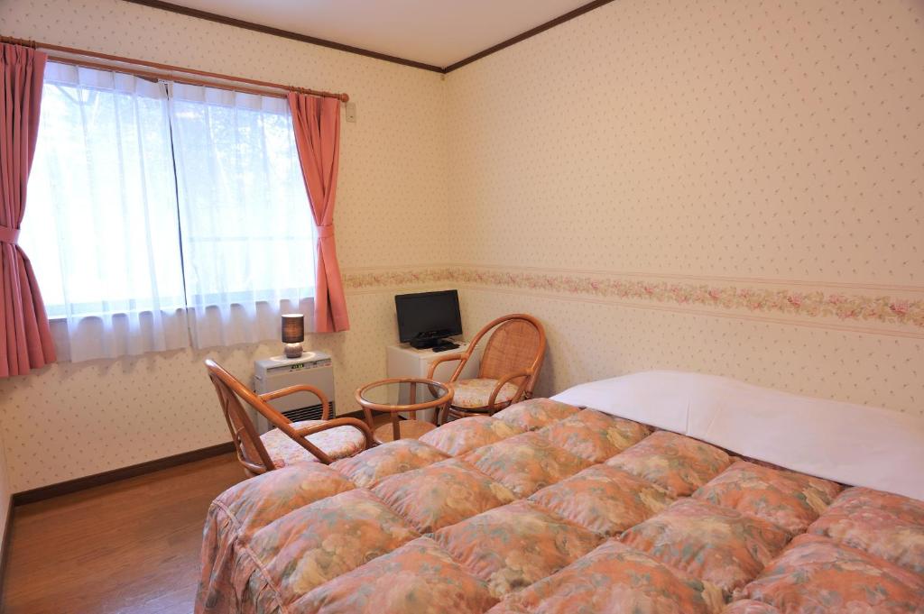 Postel nebo postele na pokoji v ubytování Anise Garden