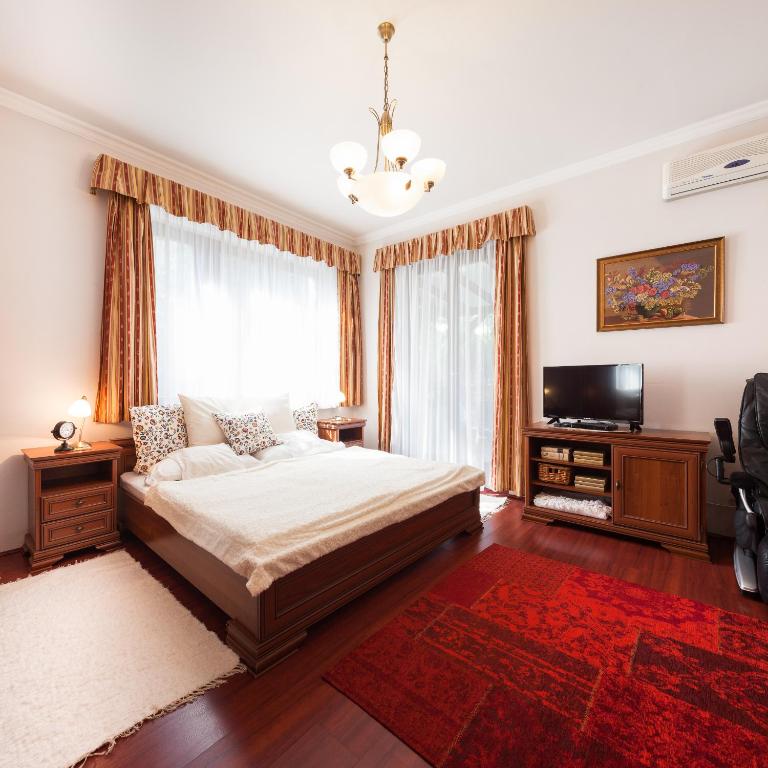 Postel nebo postele na pokoji v ubytování Villa Cecile
