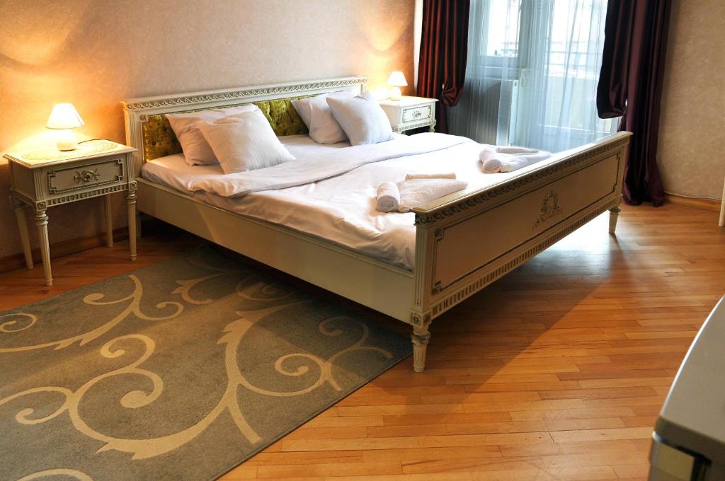 Postel nebo postele na pokoji v ubytování Hotel Gallery