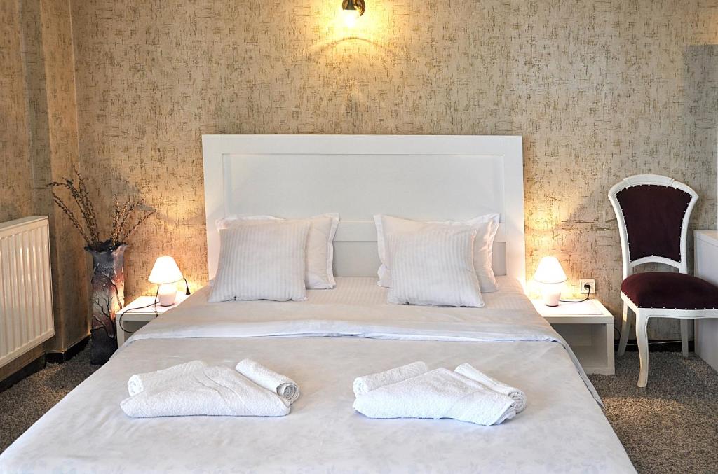 Postel nebo postele na pokoji v ubytování Hotel Gallery