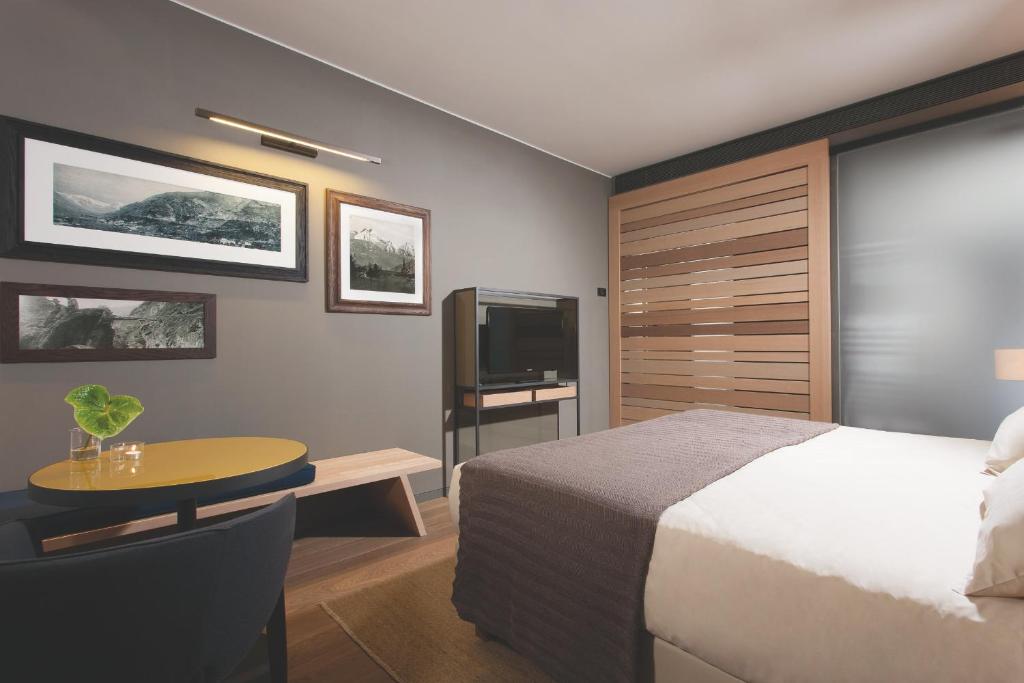 Letto o letti in una camera di Parc Hotel Billia