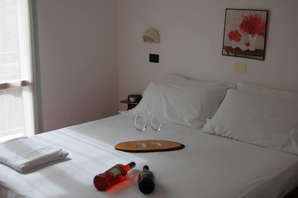 Cama o camas de una habitación en Hotel Flores