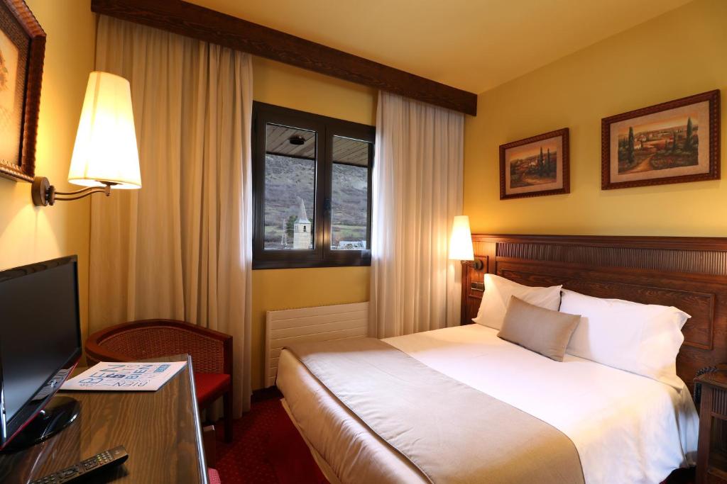 Postel nebo postele na pokoji v ubytování RVHotels Tuca