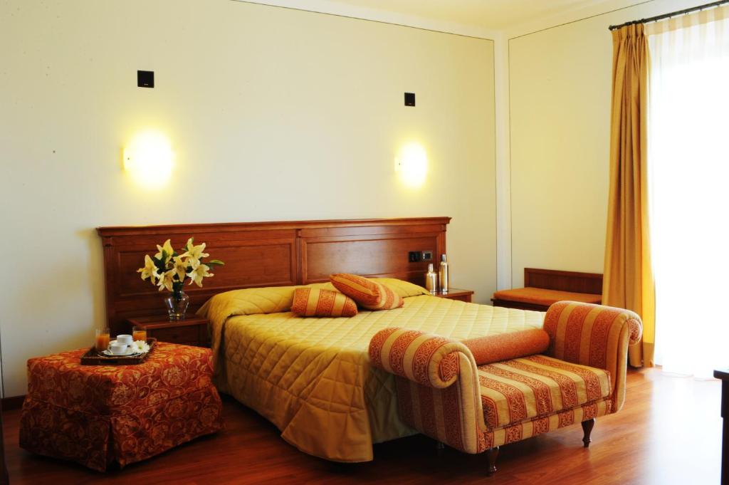 Posteľ alebo postele v izbe v ubytovaní Hotel Panoramic Montepulciano