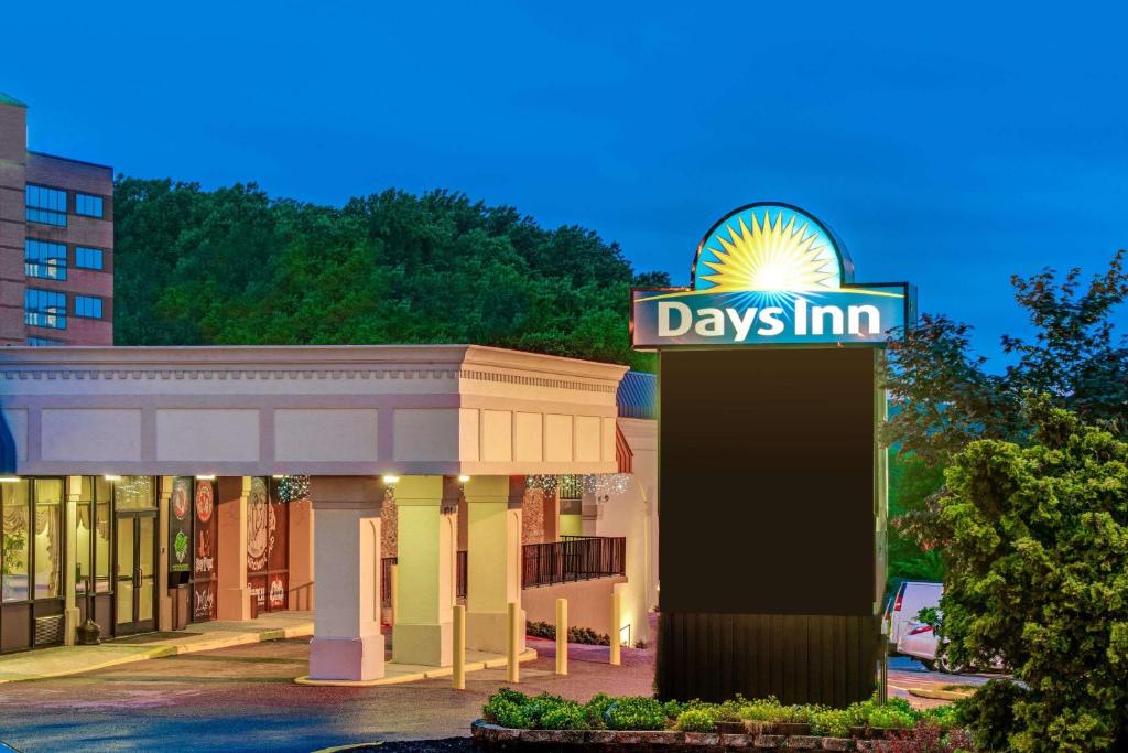 a day inn sign in front of a building at Days Inn by Wyndham Towson in Towson
