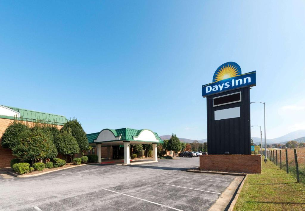 a day inn sign in front of a parking lot at Days Inn by Wyndham Luray Shenandoah in Luray