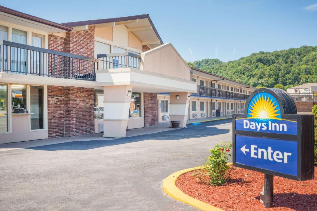 a day inn sign in front of a building at Days Inn by Wyndham Paintsville in Paintsville