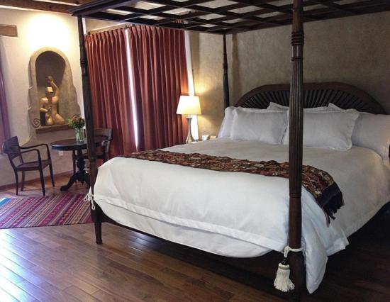 Postel nebo postele na pokoji v ubytování Guayaba Inn Boutique Hotel