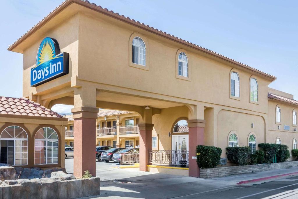 a dallas hotel with a sign on the front of it at Days Inn by Wyndham Bishop in Bishop