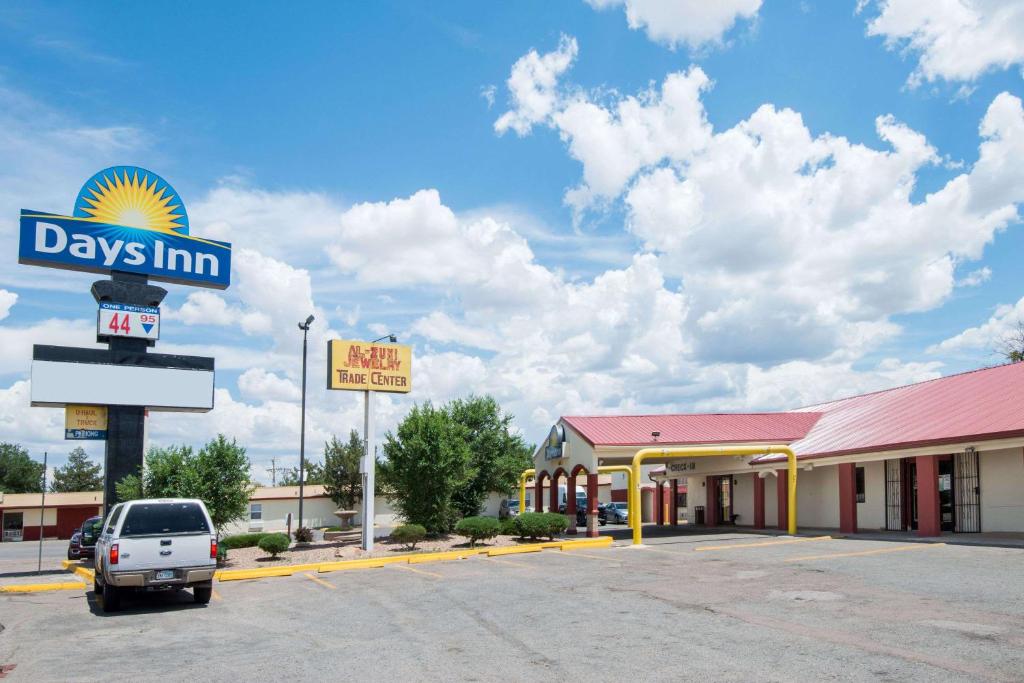 a car parked in front of a days inn at Days Inn by Wyndham Gallup in Gallup