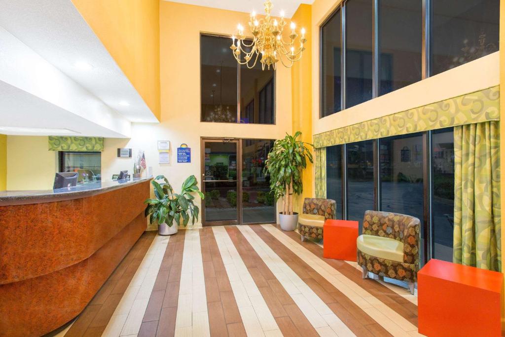 a lobby of a hospital with chairs and a bar at Days Inn by Wyndham Florence/I-95 North in Florence