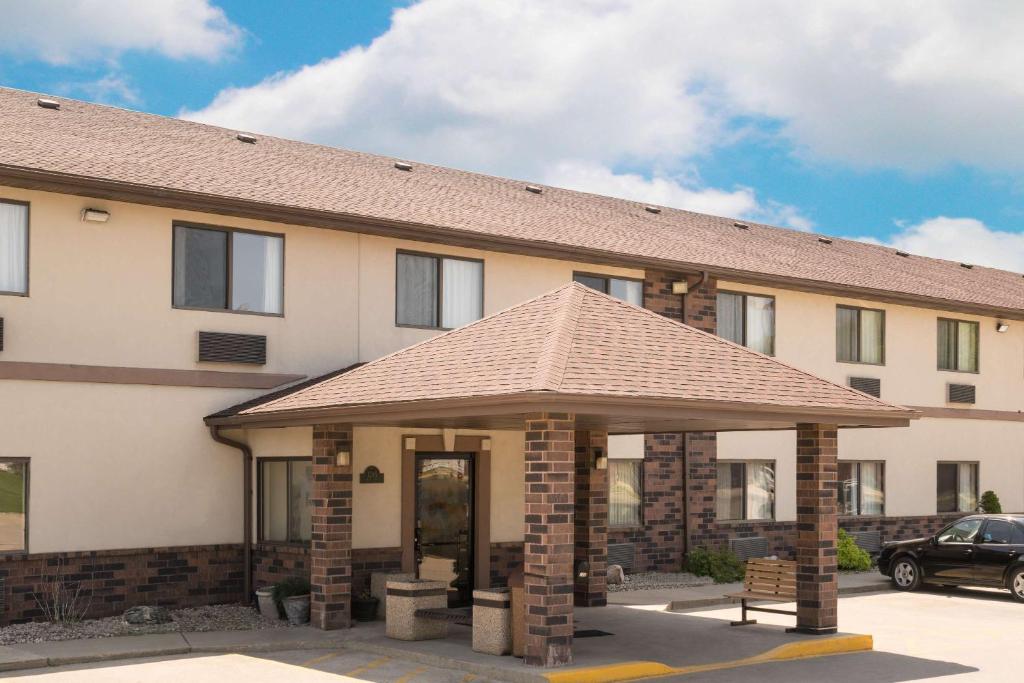 a building with a pavilion in front of it at Days Inn by Wyndham Mankato in Mankato