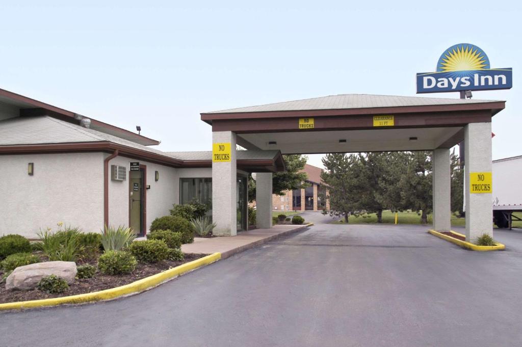 a view of a days inn with a garage at Days Inn by Wyndham Plainfield in Plainfield