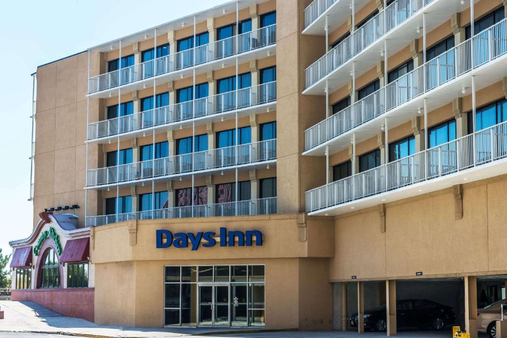 a large building with adays inn sign on it at Days Inn by Wyndham Atlantic City Oceanfront-Boardwalk in Atlantic City