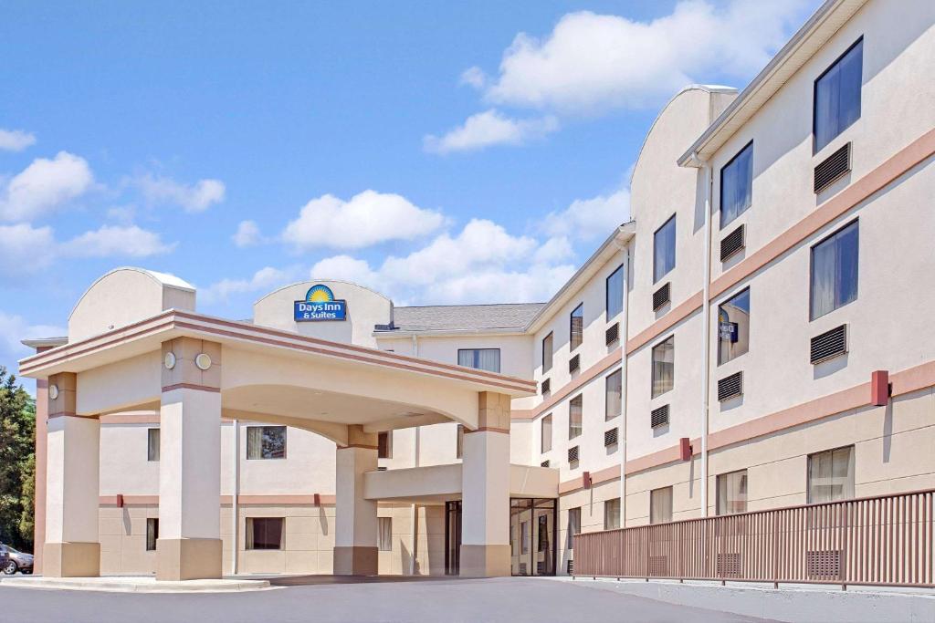 a rendering of a hospital building at Days Inn & Suites by Wyndham Laurel Near Fort Meade in Laurel