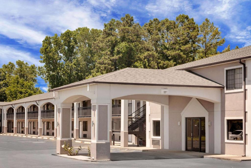 a large white building with a large entrance at Your Place Inn in Millington