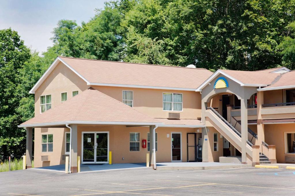 a school building with a staircase in a parking lot at Days Inn by Wyndham Fairmont in Fairmont