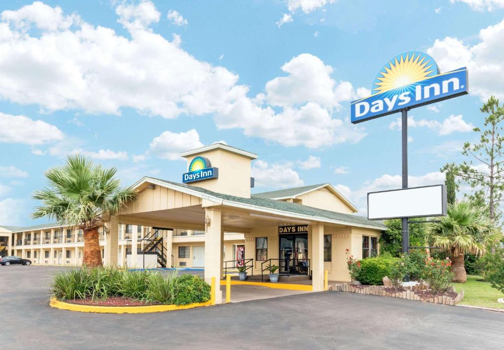 a hotel with a day inn sign in front of it at Days Inn by Wyndham Snyder in Snyder