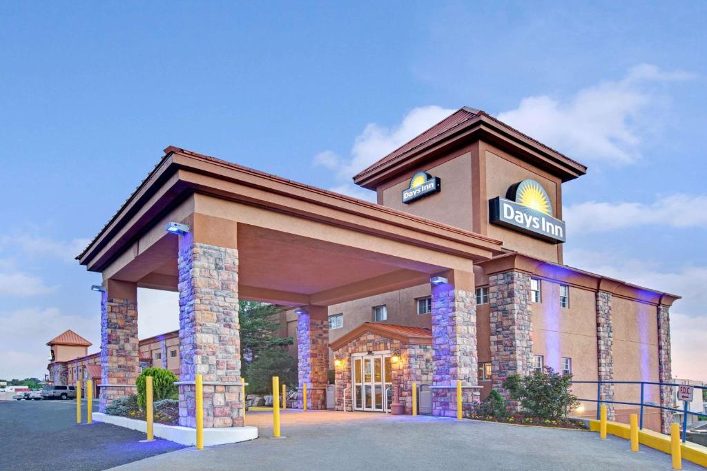 a rendering of a hotel with a sign on it at Days Inn by Wyndham Ridgefield NJ in Ridgefield