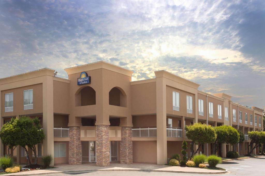 a rendering of the front of a building at Days Inn by Wyndham Greenville in Greenville