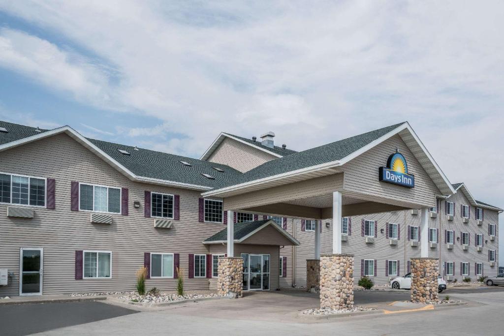 a hotel with a sign on the front of it at Days Inn by Wyndham Fargo/Casselton in Casselton