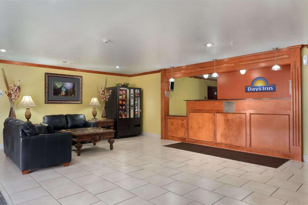 a large lobby with a waiting room with a waiting room at Days Inn by Wyndham Lumberton in Lumberton