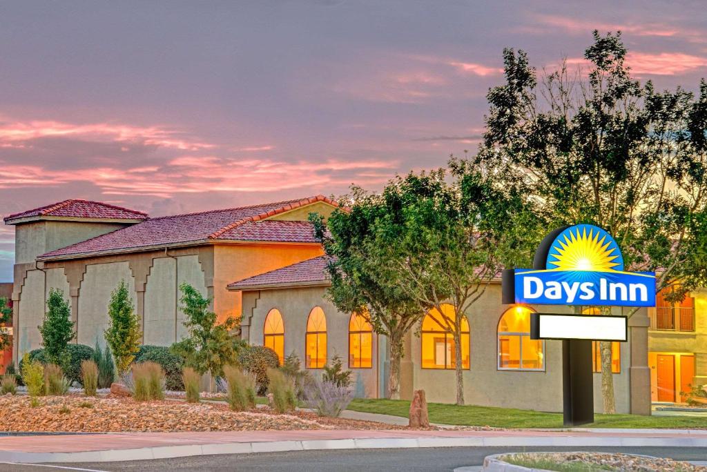 a days inn sign in front of a building at Days Inn by Wyndham Rio Rancho in Rio Rancho