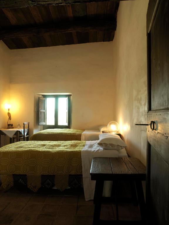 Postel nebo postele na pokoji v ubytování Sextantio Albergo Diffuso