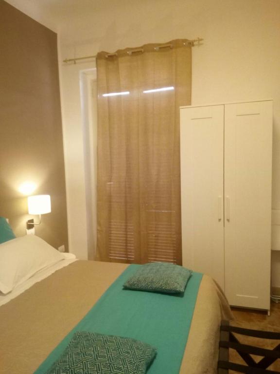 Postel nebo postele na pokoji v ubytování Le Suite dei Due Mari cucinino privato