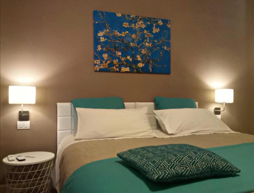 Postel nebo postele na pokoji v ubytování Le Suite dei Due Mari cucinino privato