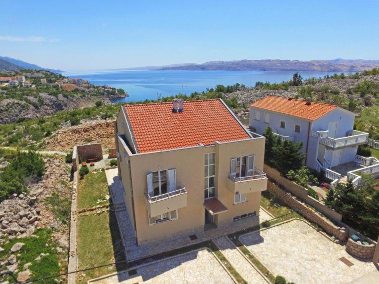 an aerial view of a house on a hill at Apartments Golub in Cesarica