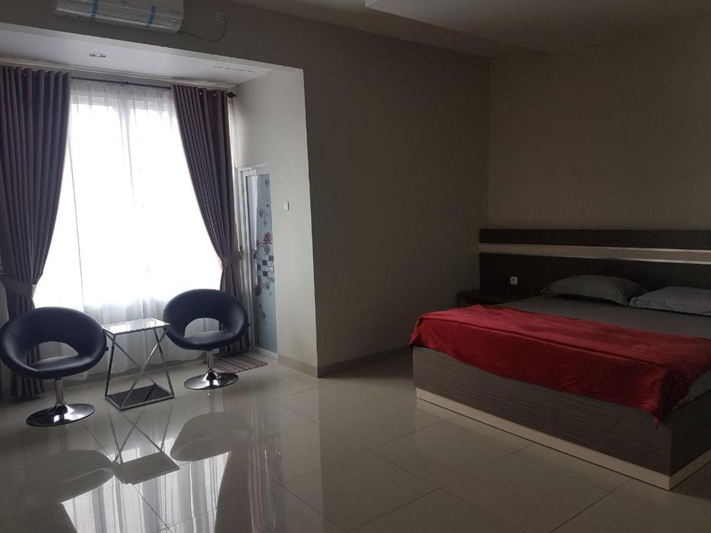 Postel nebo postele na pokoji v ubytování Hotel Grand Sigma