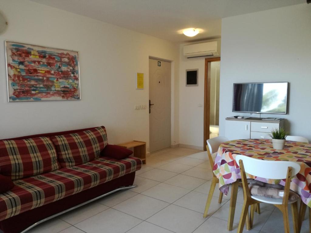 Televízia a/alebo spoločenská miestnosť v ubytovaní Apartments Henc