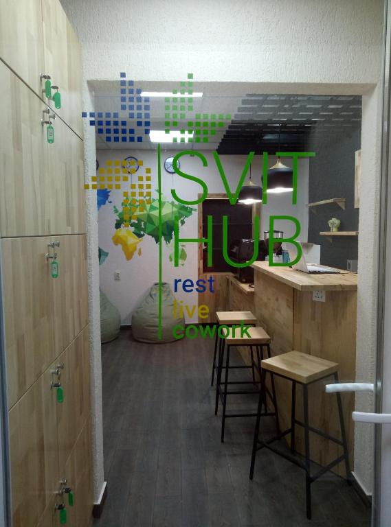 a room with a sign that reads keep fit rest us company at Hostel Svit Hub in Kamianets-Podilskyi