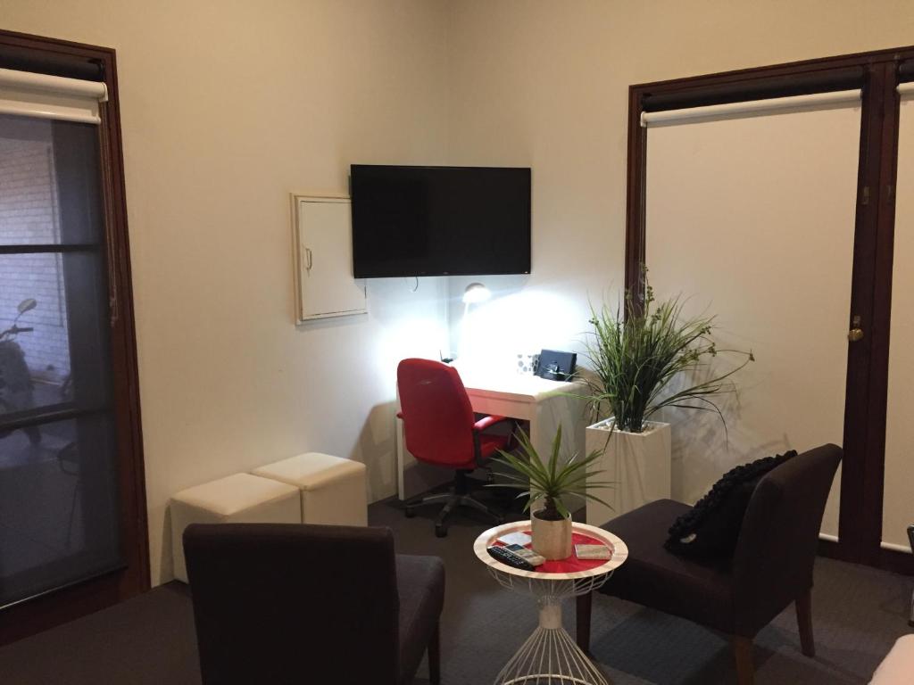 TV a/nebo společenská místnost v ubytování Fairway Manor Accommodation