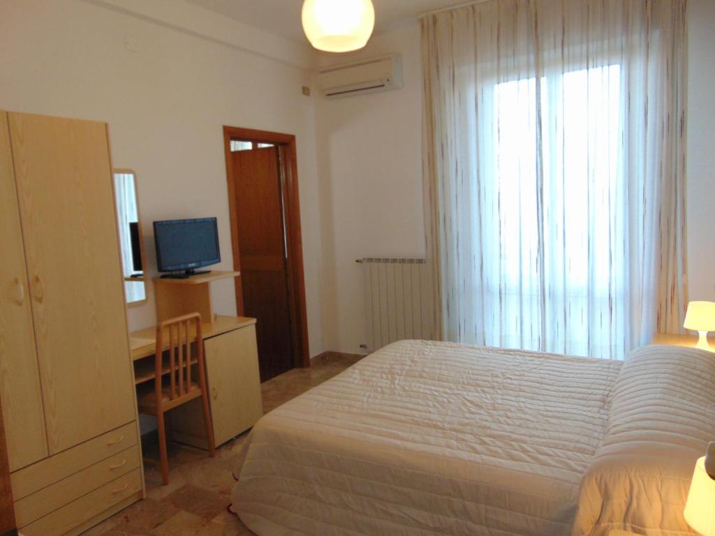 Postel nebo postele na pokoji v ubytování Albergo Rossana