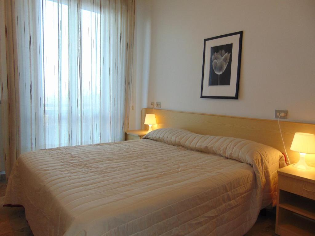 Postel nebo postele na pokoji v ubytování Albergo Rossana