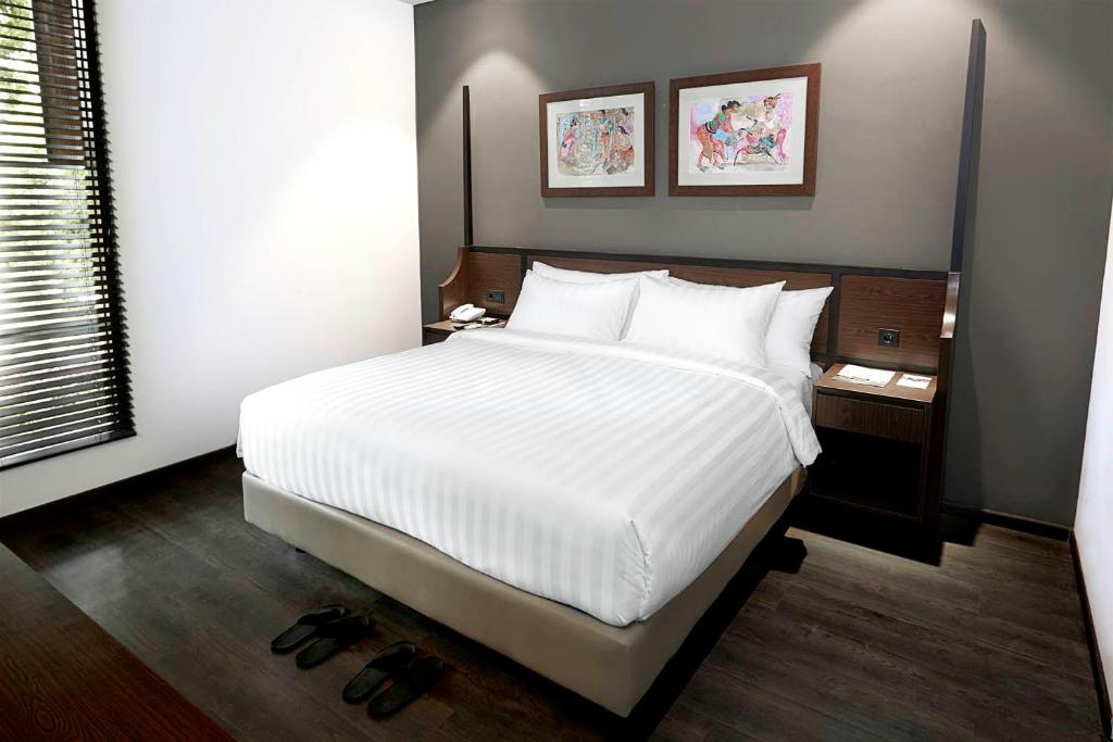 Postel nebo postele na pokoji v ubytování Amanuba Hotel & Resort Rancamaya
