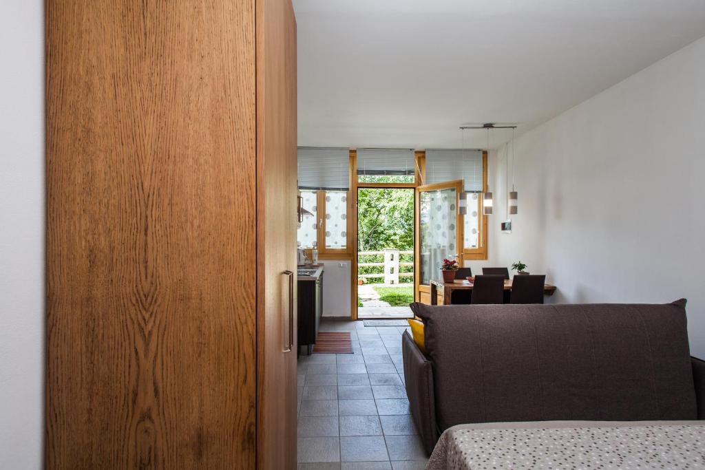 a room with a door leading to a dining room at Agriturismo La Selvaggia in Mandello del Lario