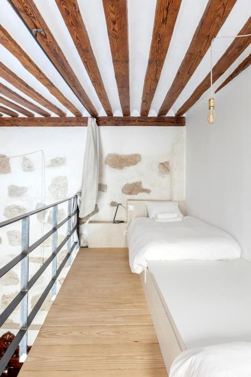 A bed or beds in a room at Don Pedro Home