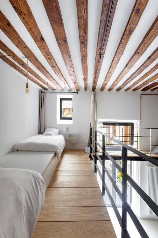 A bed or beds in a room at Don Pedro Home