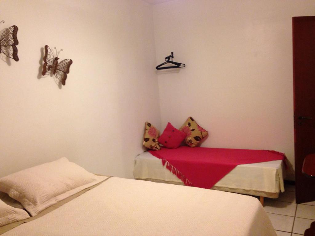 Llit o llits en una habitació de Condomínio Solar dos Reis
