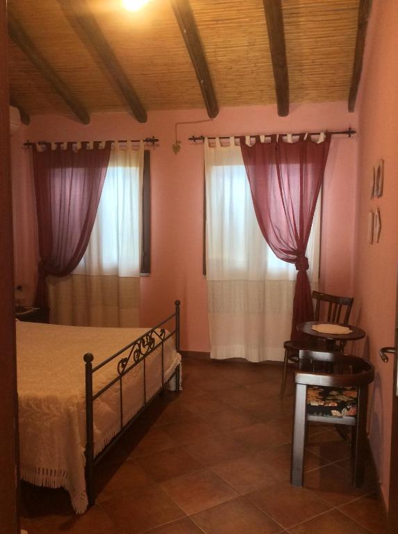 Postel nebo postele na pokoji v ubytování Tenuta Don Ballore