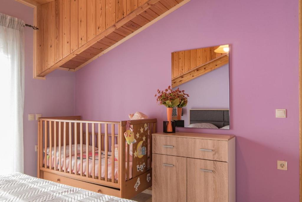 Postel nebo postele na pokoji v ubytování Mitros Apartment