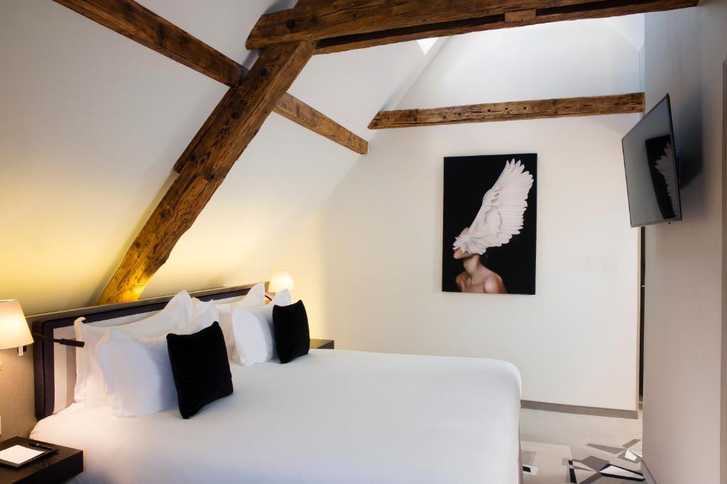 Postel nebo postele na pokoji v ubytování Boutique Hotel Des XV