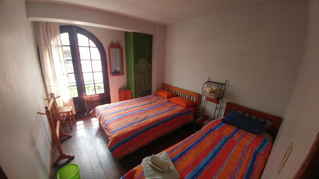 Postel nebo postele na pokoji v ubytování Anata Hostal