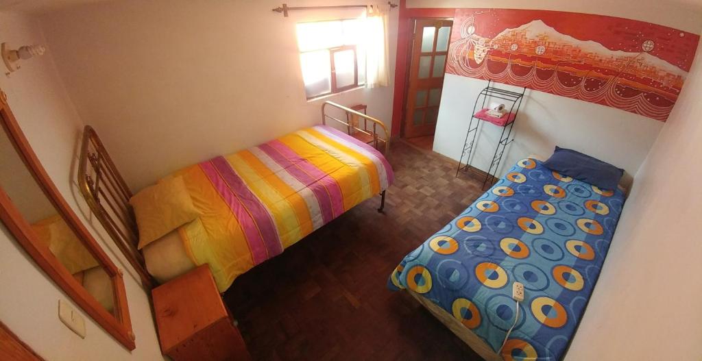 Postel nebo postele na pokoji v ubytování Anata Hostal